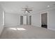 Neutral bedroom with ceiling fan and two doors offers comfortable living space with an ensuite bathroom at 7038 Elm Tree Ln, Johns Island, SC 29455