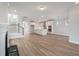 Open concept living room with wood floors, recessed lights, a fireplace, and open kitchen at 7038 Elm Tree Ln, Johns Island, SC 29455