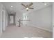 Second-floor loft area with neutral carpet and a ceiling fan at 7038 Elm Tree Ln, Johns Island, SC 29455