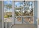 View from the screened porch, showcasing a wooded backyard at 7038 Elm Tree Ln, Johns Island, SC 29455