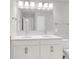 Bright bathroom featuring a double sink vanity, large mirror, and modern lighting fixtures at 123 Cantona Dr, Summerville, SC 29483