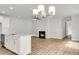 Open-concept living room featuring a fireplace, ceiling fan, and views to the kitchen at 123 Cantona Dr, Summerville, SC 29483