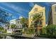 Beautiful Charleston-style homes line a canal, showcasing unique architecture and lush landscaping at 55 Rialto Rd, Mount Pleasant, SC 29464