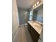 Bright bathroom with a double vanity, shower with glass door, and tile flooring at 1832 Helm Ave, North Charleston, SC 29405