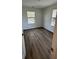 Cozy bedroom featuring hardwood floors and two windows at 1832 Helm Ave, North Charleston, SC 29405