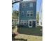Back exterior view of a two-story home with blue siding and green lawn at 1832 Helm Ave, North Charleston, SC 29405
