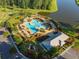 Aerial view of a community pool and playground next to a pond at 190 Lindera Preserve Blvd, Summerville, SC 29486