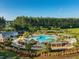 An aerial shot captures the community pool, play area, and surrounding landscaping at 190 Lindera Preserve Blvd, Summerville, SC 29486
