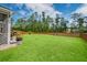 Manicured lawn and wooden fence defines this expansive backyard at 190 Lindera Preserve Blvd, Summerville, SC 29486