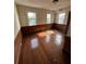 Bright bedroom with hardwood floors and large windows at 2 Ducs Ct, Charleston, SC 29403