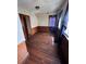 Simple bedroom with hardwood floors and wood paneling at 2 Ducs Ct, Charleston, SC 29403