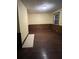 Spacious bedroom with hardwood floors and wood paneling at 2 Ducs Ct, Charleston, SC 29403