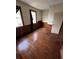 Bedroom with hardwood floors and wood paneled walls at 2 Ducs Ct, Charleston, SC 29403