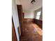 Hardwood floor bedroom with wood paneling and built-in shelving at 2 Ducs Ct, Charleston, SC 29403