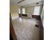 Empty dining room featuring tile floors and wood paneling at 2 Ducs Ct, Charleston, SC 29403