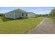 A lovely single story house boasts a manicured lawn and neutral color palette at 6269 Gritman Dr, Hollywood, SC 29470