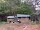 Rustic chicken coop with several chickens at 1661 Lonnie Taylor Ln, Wadmalaw Island, SC 29487