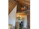 Small kitchen with loft bed and open shelving at 1661 Lonnie Taylor Ln, Wadmalaw Island, SC 29487