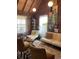 Relaxing living area with wood walls and comfy seating at 1661 Lonnie Taylor Ln, Wadmalaw Island, SC 29487