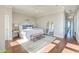 Spacious primary bedroom with hardwood floors and a cozy sitting area at 169 Cooper River Dr, Mount Pleasant, SC 29464