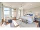 Bright bedroom with large windows, hardwood floors, and a cozy sitting area at 169 Cooper River Dr, Mount Pleasant, SC 29464