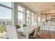 Bright dining area with city views and modern farmhouse table at 169 Cooper River Dr, Mount Pleasant, SC 29464