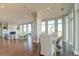 Bright dining room with hardwood floors, large windows, and water views at 169 Cooper River Dr, Mount Pleasant, SC 29464