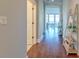Light-filled hallway with hardwood floors and built-in shelving at 169 Cooper River Dr, Mount Pleasant, SC 29464