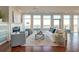 Spacious living room with hardwood floors, fireplace and stunning water views at 169 Cooper River Dr, Mount Pleasant, SC 29464