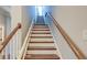 Staircase with wooden railing and chair lift at 169 Cooper River Dr, Mount Pleasant, SC 29464