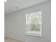 This bedroom offers natural light with neutral-toned walls and carpet at 6261 Gritman Dr, Hollywood, SC 29470