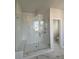 Bathroom with tile floors, glass shower, bench, and rainfall shower head at 1075 Keeper Ln, Summerville, SC 29485
