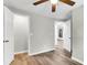 Bright bedroom with wood-look floors, spacious closet, and access to another room at 1979 Macon Ave, North Charleston, SC 29405