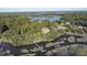 Aerial view showcasing a waterfront home with private dock and scenic surroundings at 4415 Lord Proprietors Rd, Hollywood, SC 29449