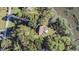 Aerial view of home featuring a backyard pool, surrounded by lush trees and access to the river at 4415 Lord Proprietors Rd, Hollywood, SC 29449