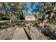 Charming home featuring a sprawling yard, picturesque dock, and serene waterfront access at 4415 Lord Proprietors Rd, Hollywood, SC 29449