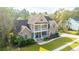 Beautiful two-story home featuring a welcoming double porch and well-manicured lawn at 1068 Blockade Runner Pkwy, Summerville, SC 29485