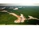 Aerial view showing new home construction and surrounding green space at 114 Lilac Grove Way, Summerville, SC 29486