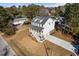 Aerial view of a two story house with gray roof and white siding, large yard, and driveway at 1577 Periwinkle Dr, Mount Pleasant, SC 29466