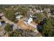 Aerial view of a two-story house with a gray roof and white siding, and a large yard at 1577 Periwinkle Dr, Mount Pleasant, SC 29466