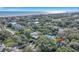 Aerial view of a house near the beach, surrounded by lush trees and other homes at 19 23Rd Ave, Isle of Palms, SC 29451