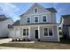 Charming two-story home with gray siding, white trim, and a covered front porch at 1096 Keeper Ln, Summerville, SC 29485