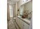 Well-lit bathroom boasts double sinks, granite countertops, and a neutral color palette, providing a spa-like experience at 3105 Sturbridge Rd, Mount Pleasant, SC 29466