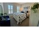 Serene bedroom with coastal-themed bedding, shuttered windows, and nautical artwork, creating a relaxing and inviting retreat at 3105 Sturbridge Rd, Mount Pleasant, SC 29466