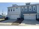 Modern townhomes with attached garages and well-maintained exteriors, showcasing contemporary design and curb appeal at 3105 Sturbridge Rd, Mount Pleasant, SC 29466