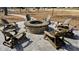 A cozy brick fire pit surrounded by Adirondack chairs creates an inviting outdoor gathering space at 3105 Sturbridge Rd, Mount Pleasant, SC 29466