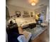 Cozy living room features stylish furnishings, a unique rug, and curated artwork, creating a welcoming and sophisticated atmosphere at 3105 Sturbridge Rd, Mount Pleasant, SC 29466