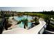 Resort-style swimming pool with waterslide, sun loungers, and lush landscaping at the community clubhouse at 3105 Sturbridge Rd, Mount Pleasant, SC 29466