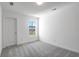 Bedroom offers natural light, carpet flooring, and white trim throughout the home at 185 Surf Bird Rd # 506P, Summerville, SC 29486