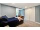 Bedroom featuring a bed, double door closet, carpet flooring, and light blue walls at 118 Carter, Walterboro, SC 29488